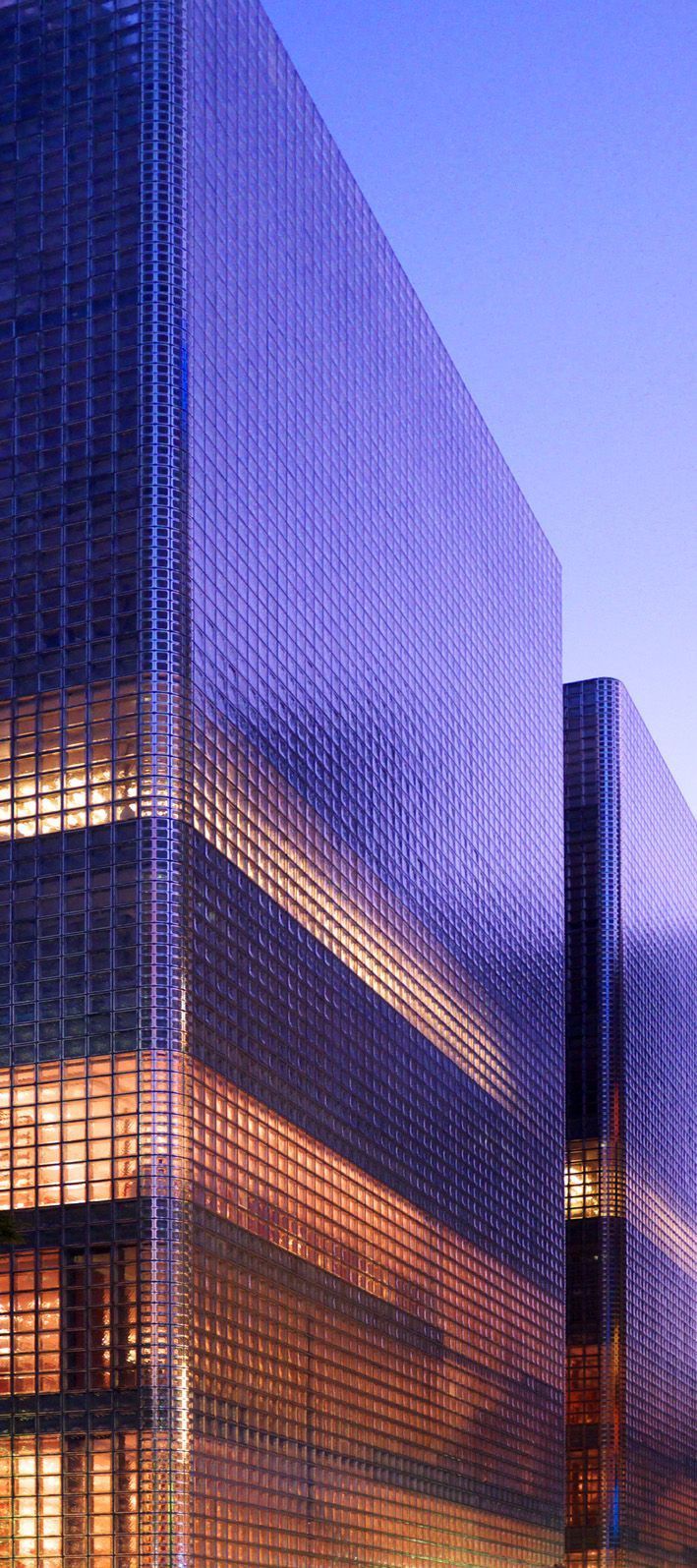 Illuminated glass towers across the financial economy